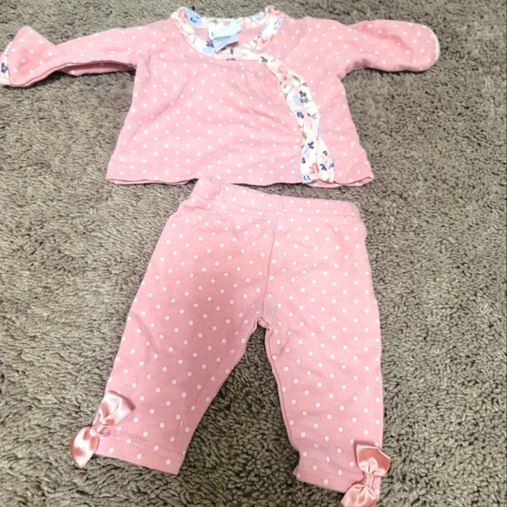 Baby poka dot outfit with floral button trim and pants to match.